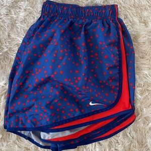 Nike Dri-Fit women’s star Lightweight running/workout shorts. Color: Red & Blue
